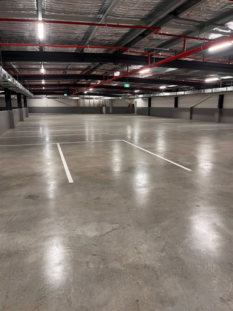 Sealed carpark, looking down the aisle