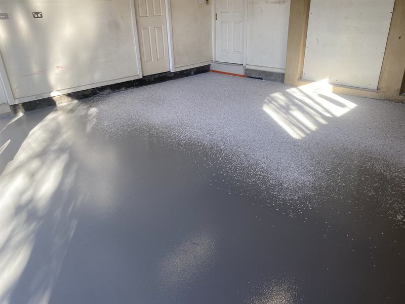 Decorative flake broadcast into wet epoxy