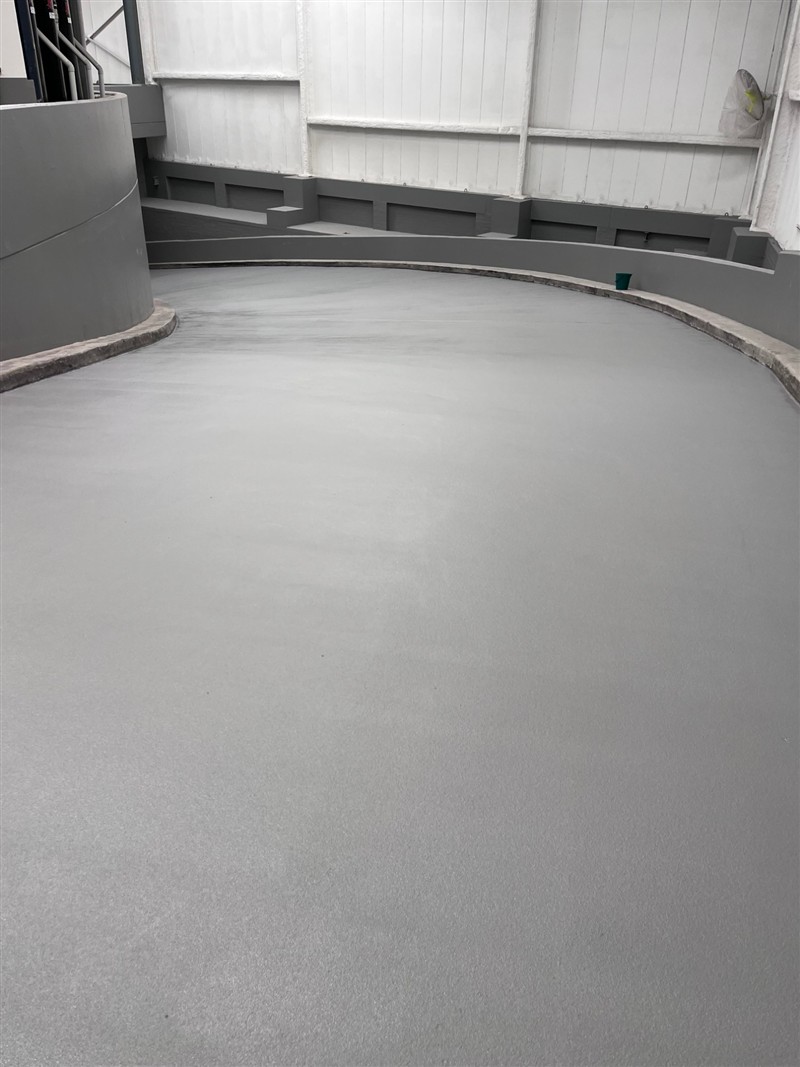 Curved driveway ramp finished in fresh grey epoxy