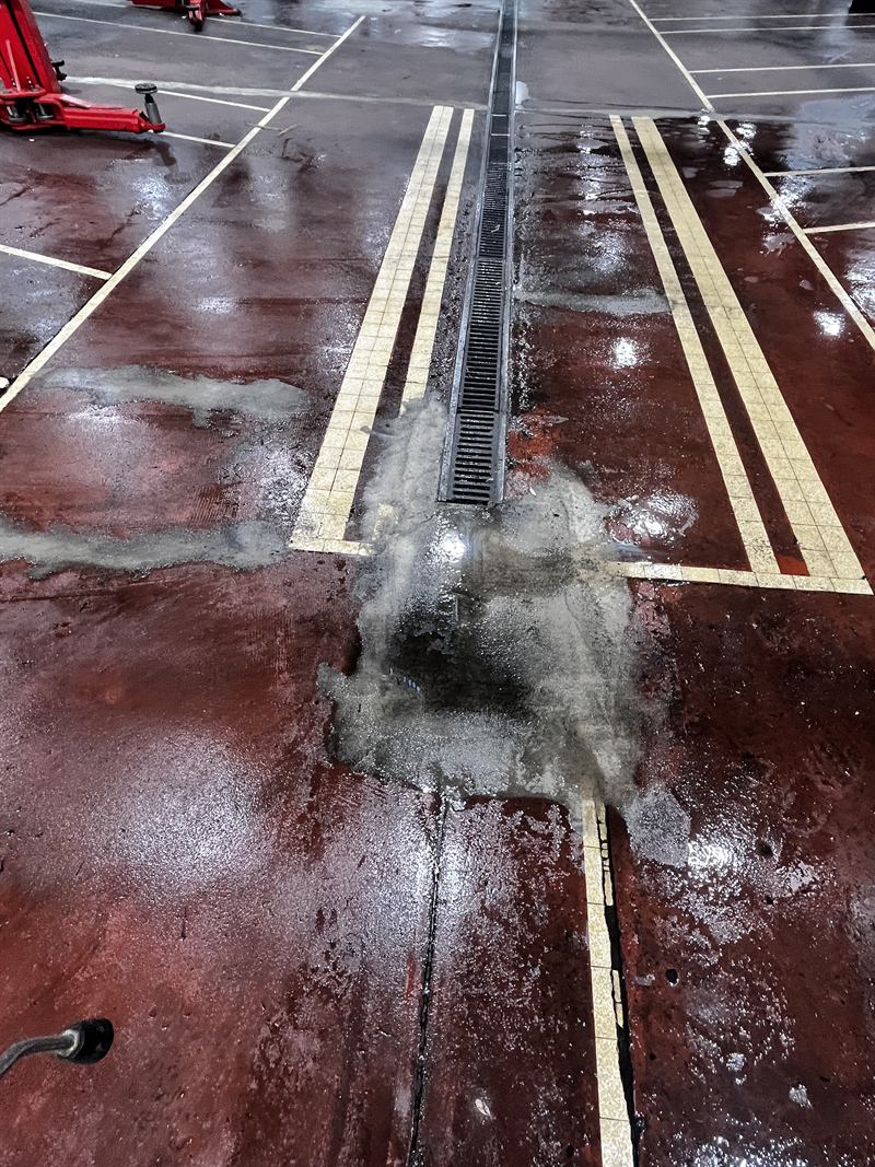 Before: worn workshop floor