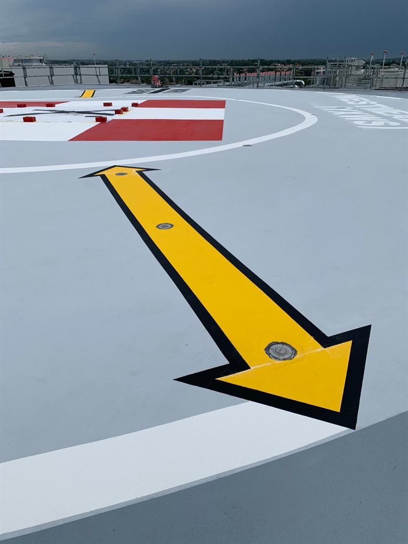 Yellow wayfinding arrow leading to the touchdown area