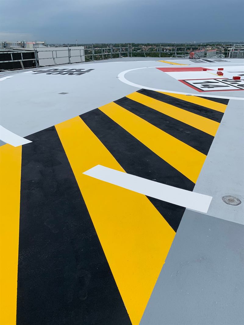 Hazard striping at the helipad edge