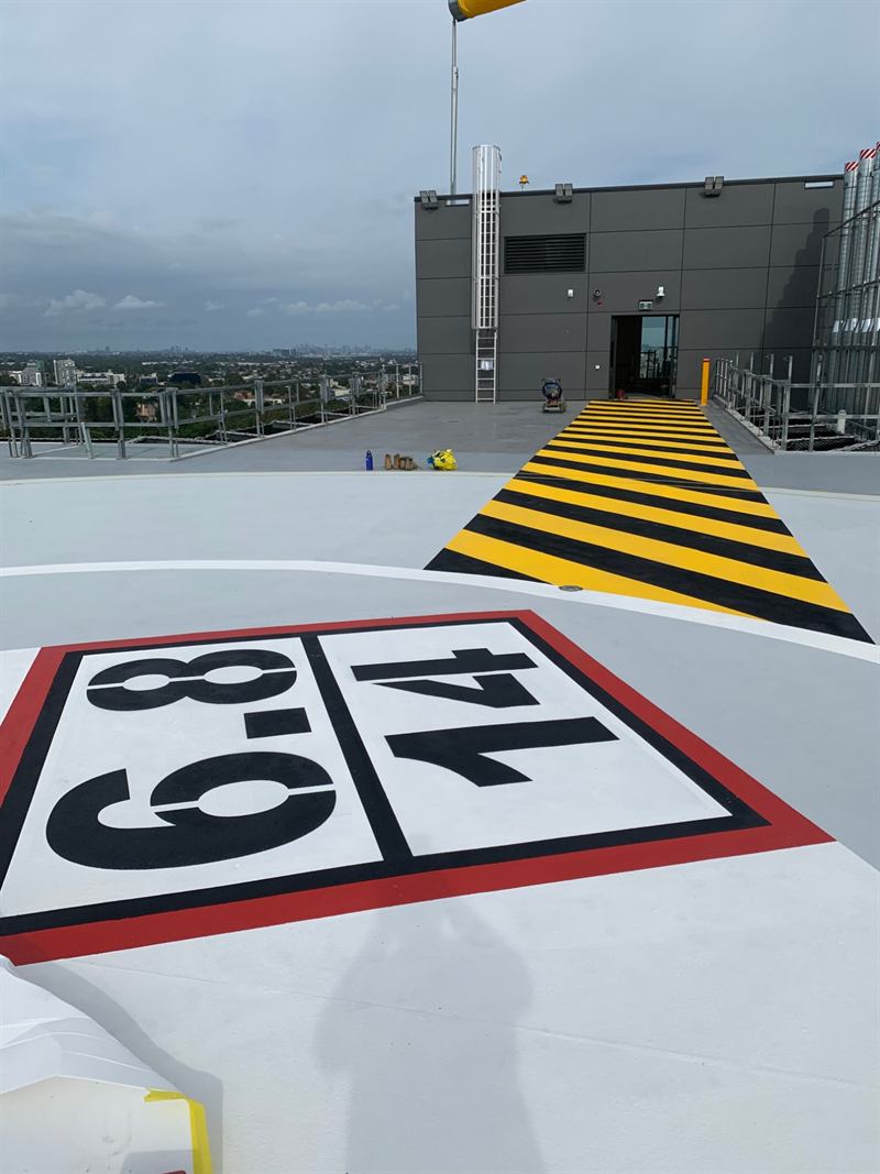 Westmead Hospital helipad weight marking and hazard-striped walkway
