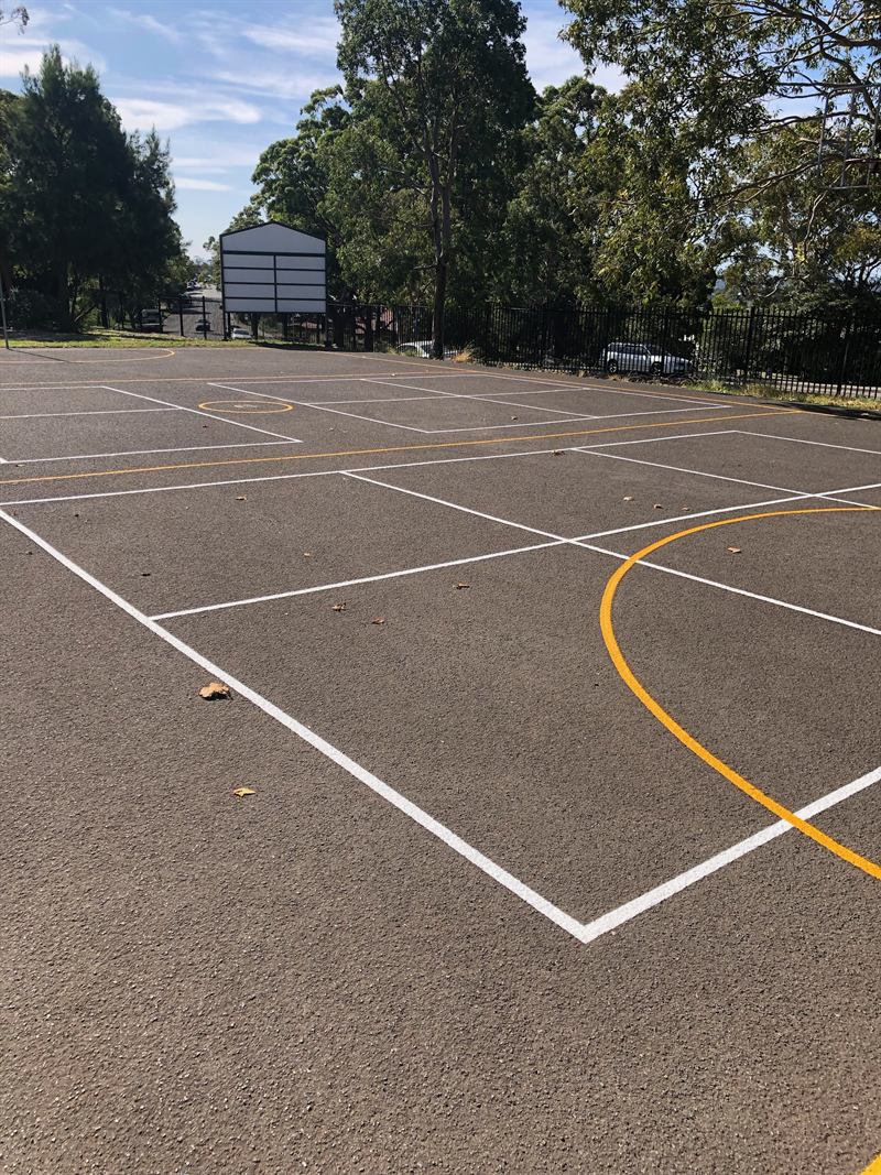 Outdoor multi-court linemarking at a school