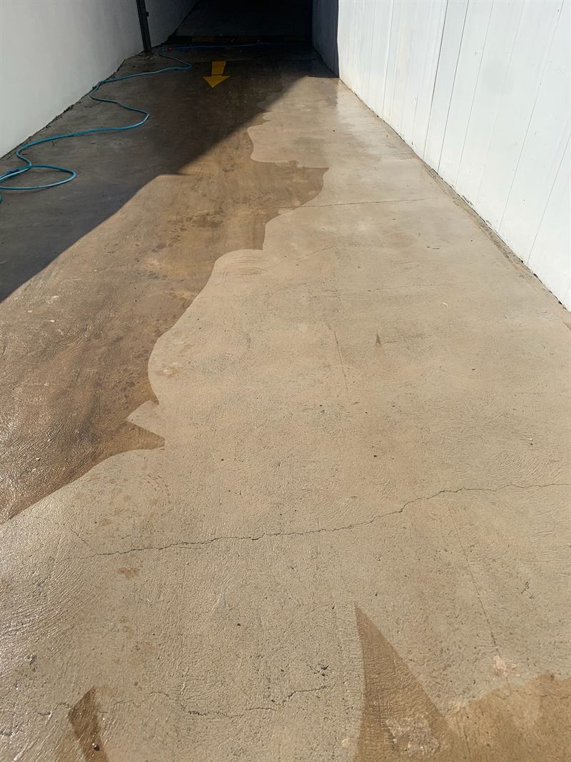Pressure cleaning a concrete path